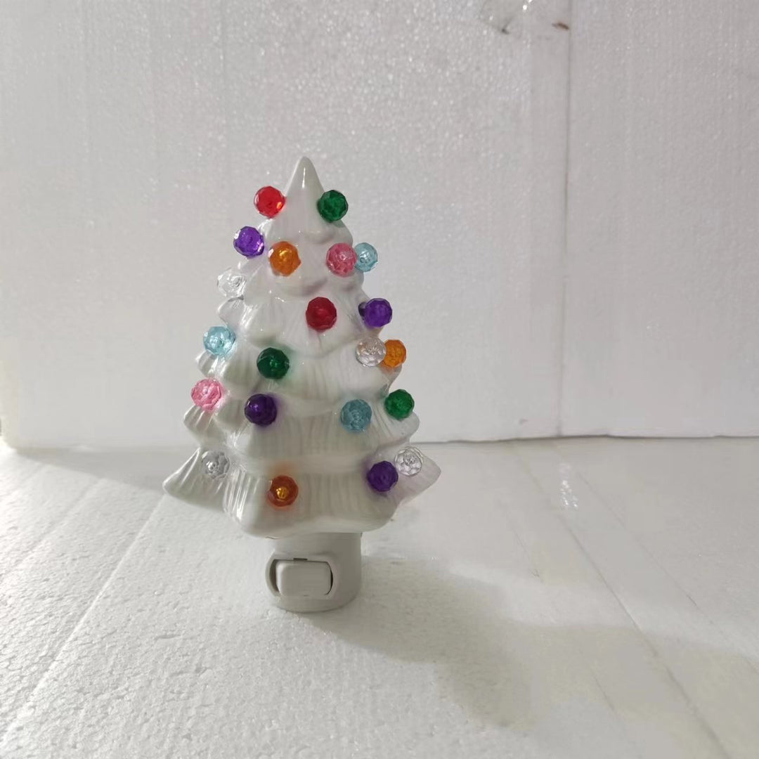 Illuminated Christmas tree figure made of resin