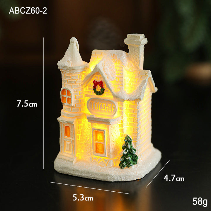 Illuminated miniature snow house made of resin