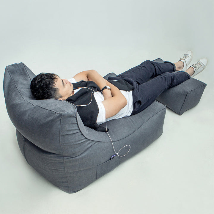 Comfortable lounge bean bag with ergonomic backrest and separate footstool