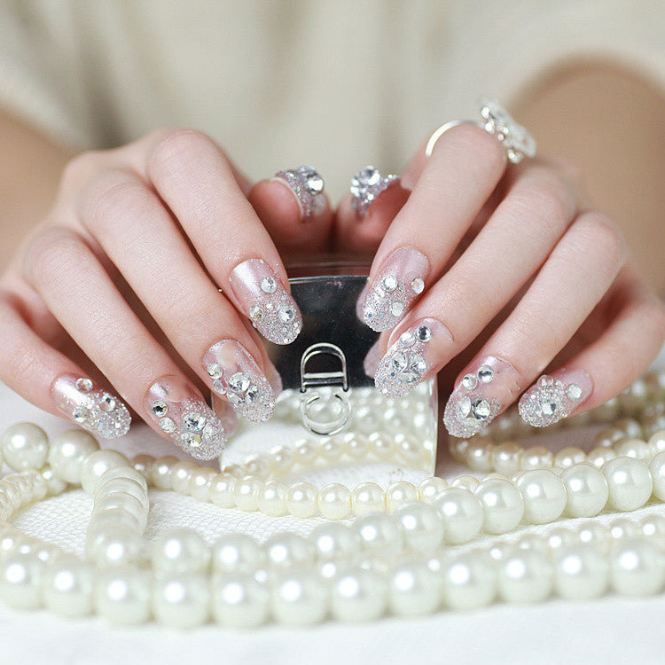 Sparkling artificial nails with rhinestones and sparkling accents Stornfield