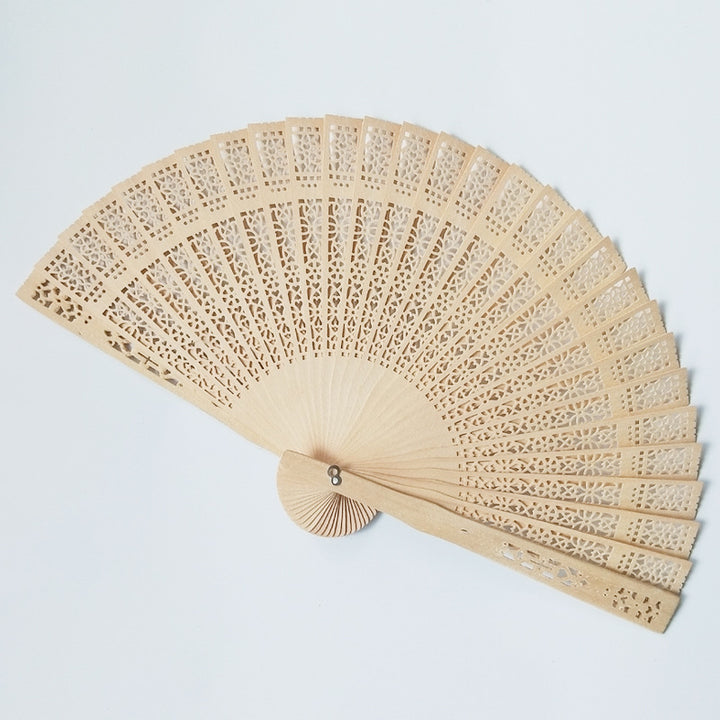 Women's fan made of elegant, intricately perforated material Stornfield