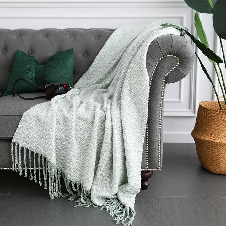 Throw blanket and plaid with herringbone structure, soft cotton blend and decorative fringes Stornfield