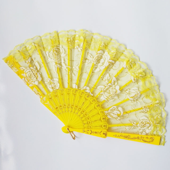 Ladies elegant fan made of sheer lace with floral embellishments Stornfield