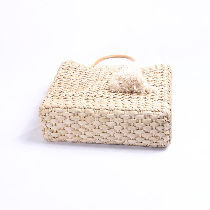 Handcrafted straw shoulder bag with decorative tassel pendant Stornfield