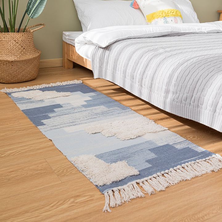Modern woven living room rug with abstract structure and tufted high-pile accents Stornfield
