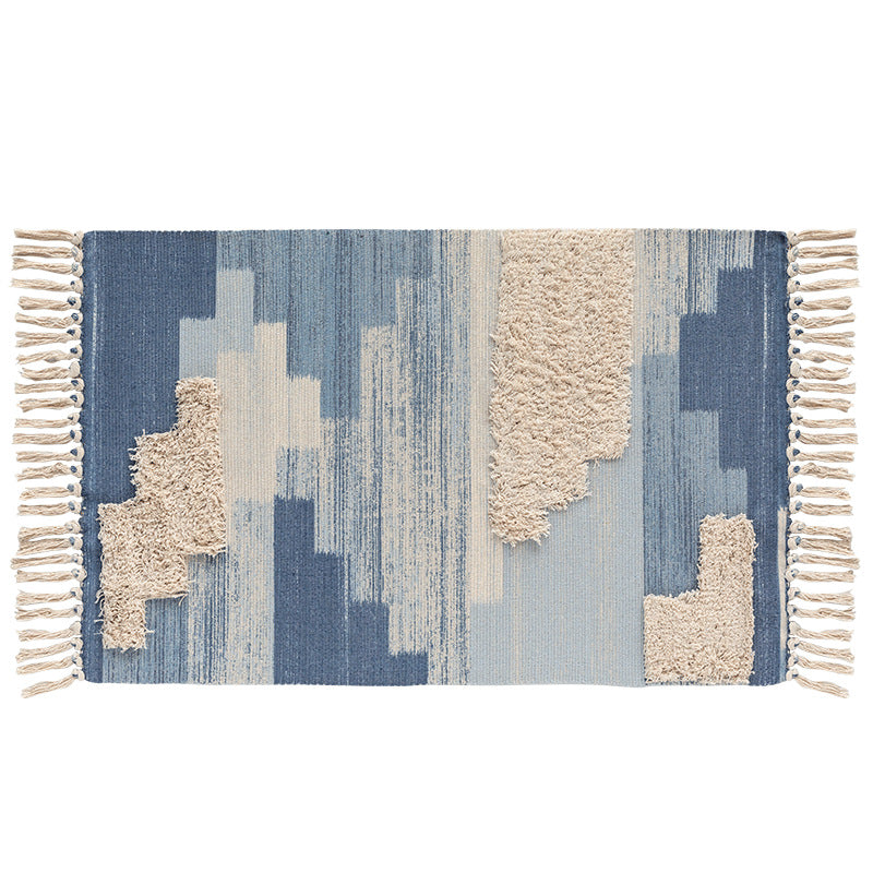Modern woven living room rug with abstract structure and tufted high-pile accents Stornfield