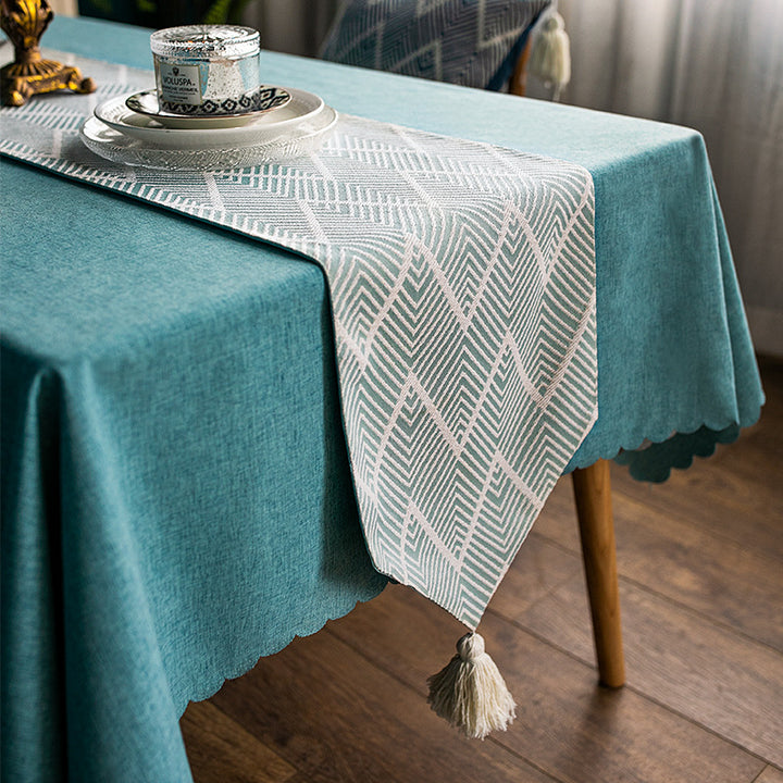 More modern woven table runner made of cotton blend with chevron jacquard and tassels