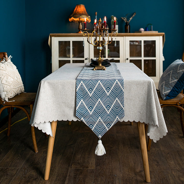 More modern woven table runner made of cotton blend with chevron jacquard and tassels