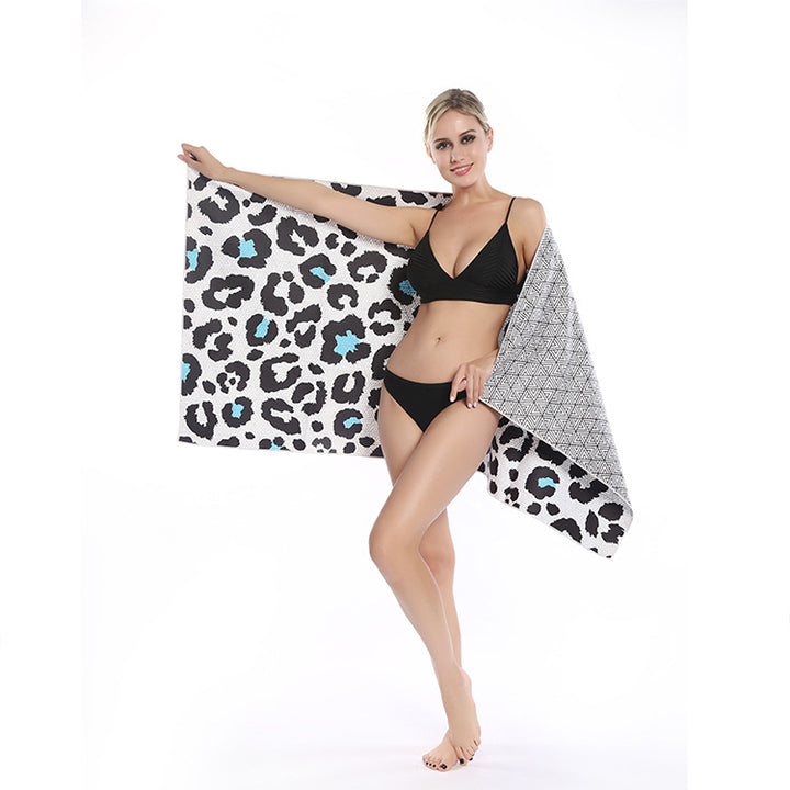 Beach towel with striking leopard motif and colorful accents Stornfield