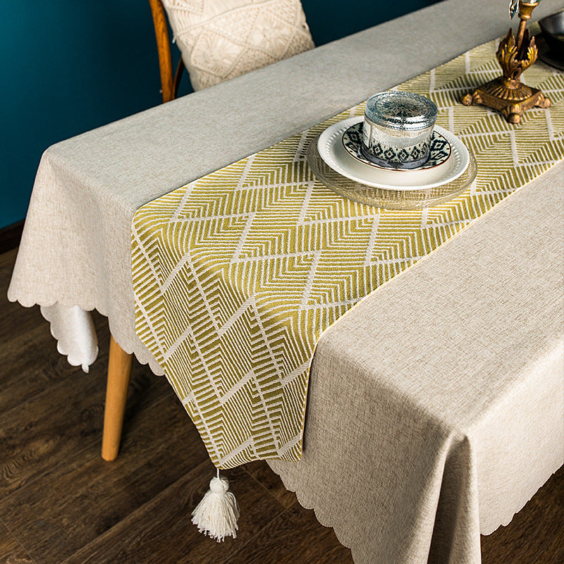 More modern woven table runner made of cotton blend with chevron jacquard and tassels