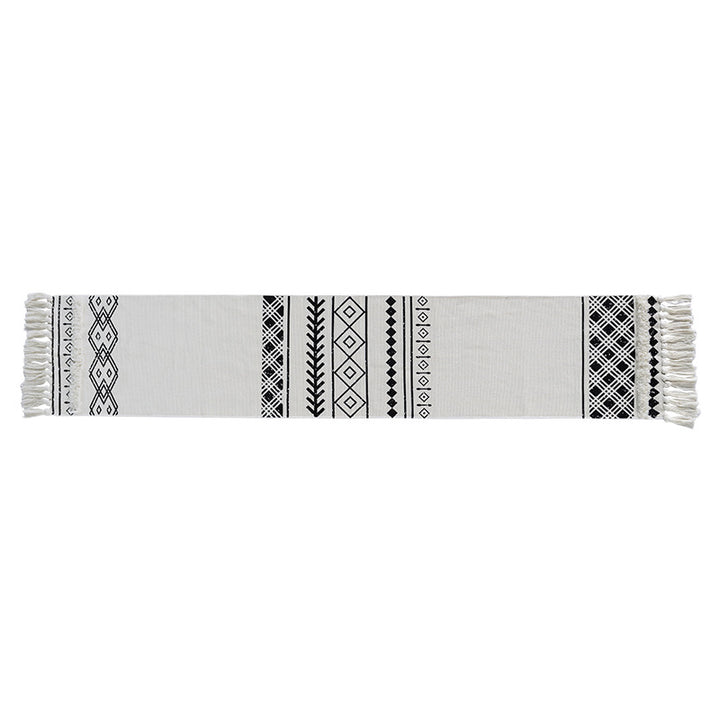 Boho table runner made of cotton blend with woven ethnic jacquard and decorative fringes Stornfield