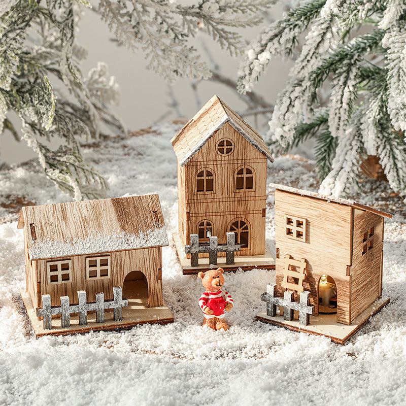 Illuminated wooden Christmas house in Scandinavian style