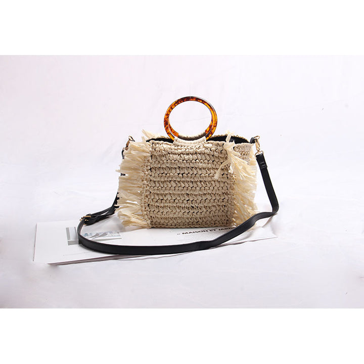 Handmade raffia shoulder bag with fringed accents Stornfield