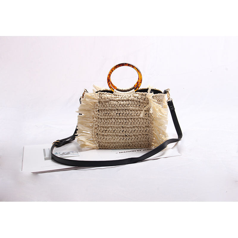 Handmade raffia shoulder bag with fringed accents Stornfield