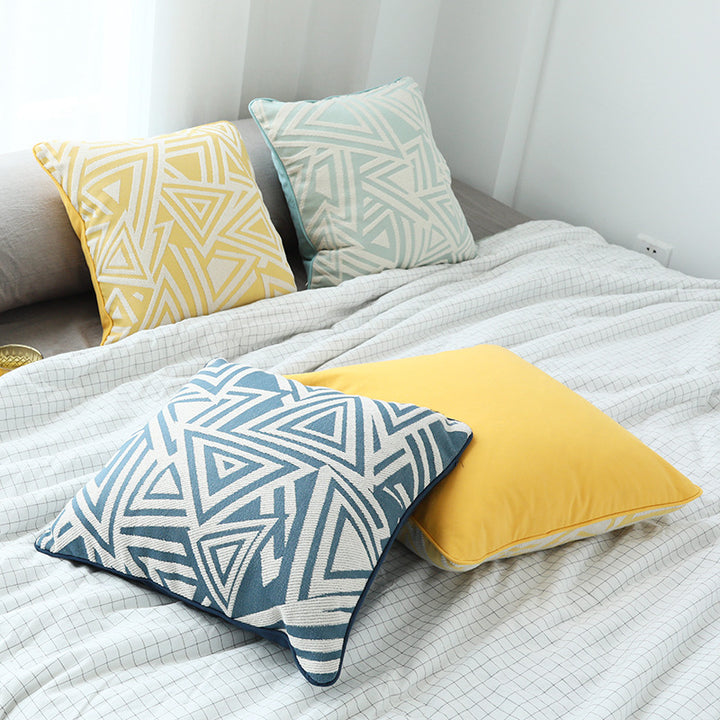 Square cushion cover with double-sided jacquard triangle motif and piping