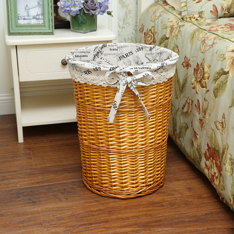 Women's laundry basket made of woven natural material with decorative fabric lining Stornfield
