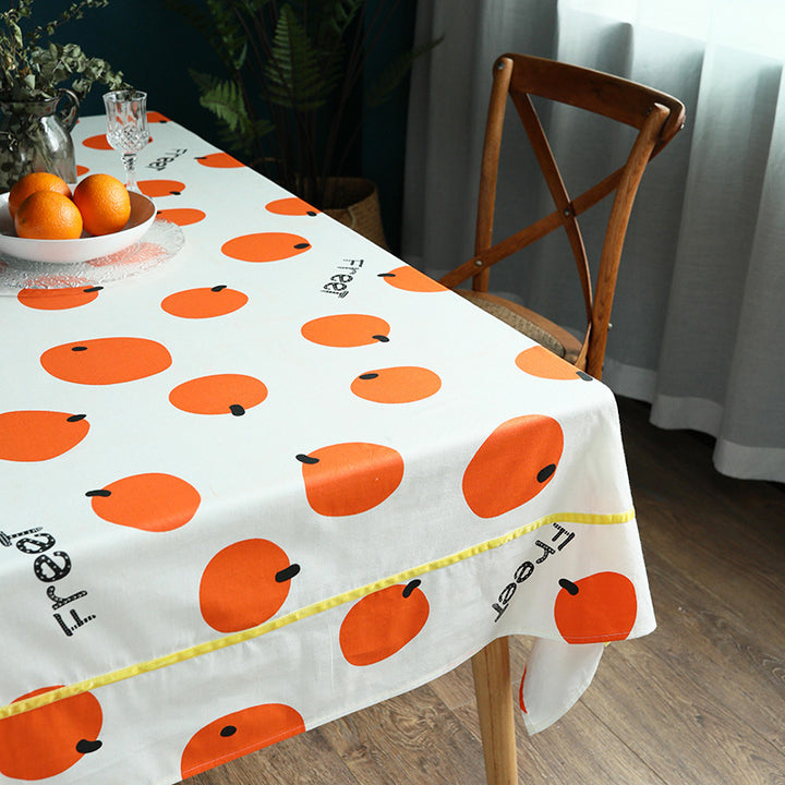 Water-repellent tablecloth with fruity citrus print and easy-care coating