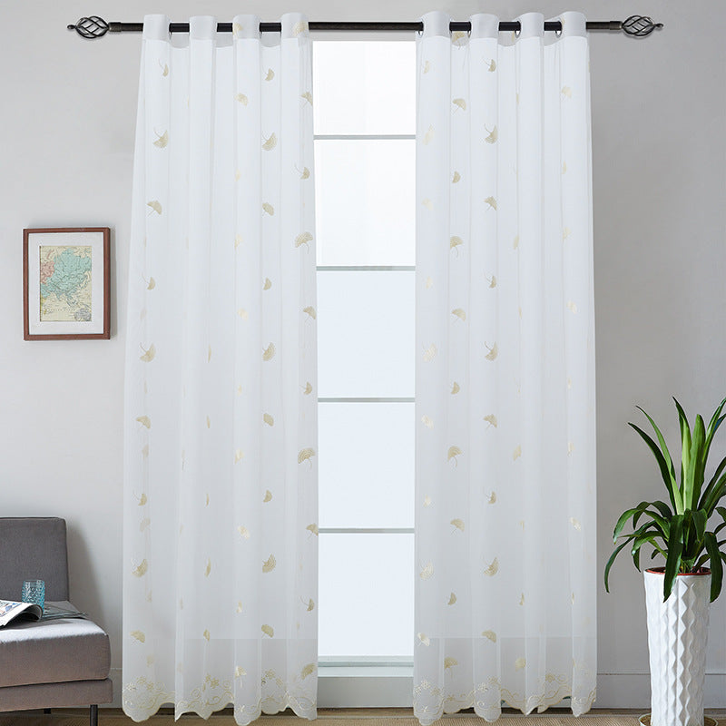 Transparent curtain drape made of fine tulle with embroidered ginkgo leaves and curved lace finish Stornfield