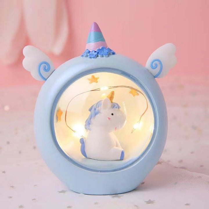 Decorative animal figure with pencil holder and light