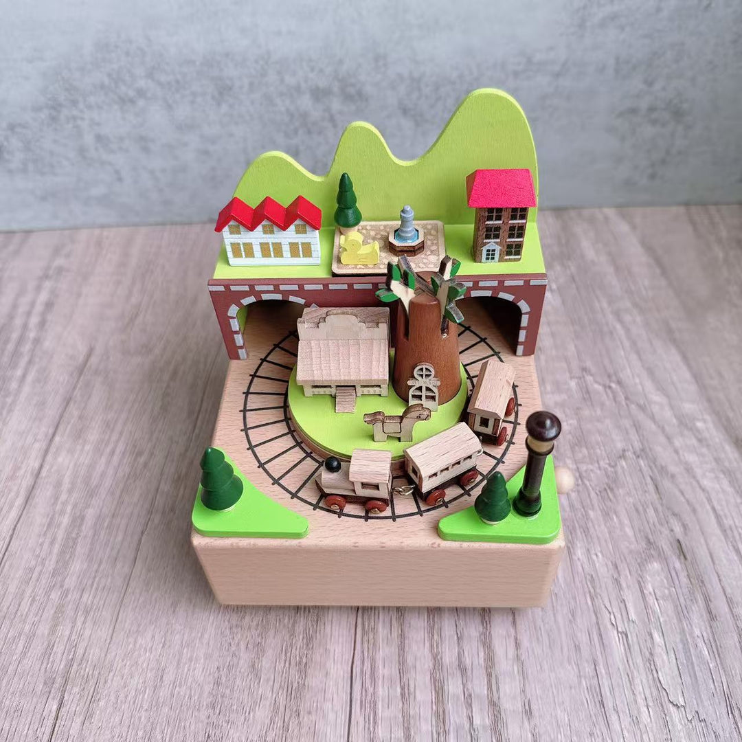Manual music box made of beech wood with forest train motif