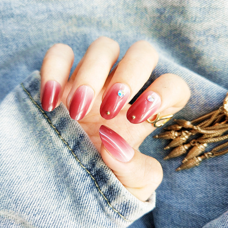 Artificial nails with elegant ombre effect and rhinestone decorations Stornfield