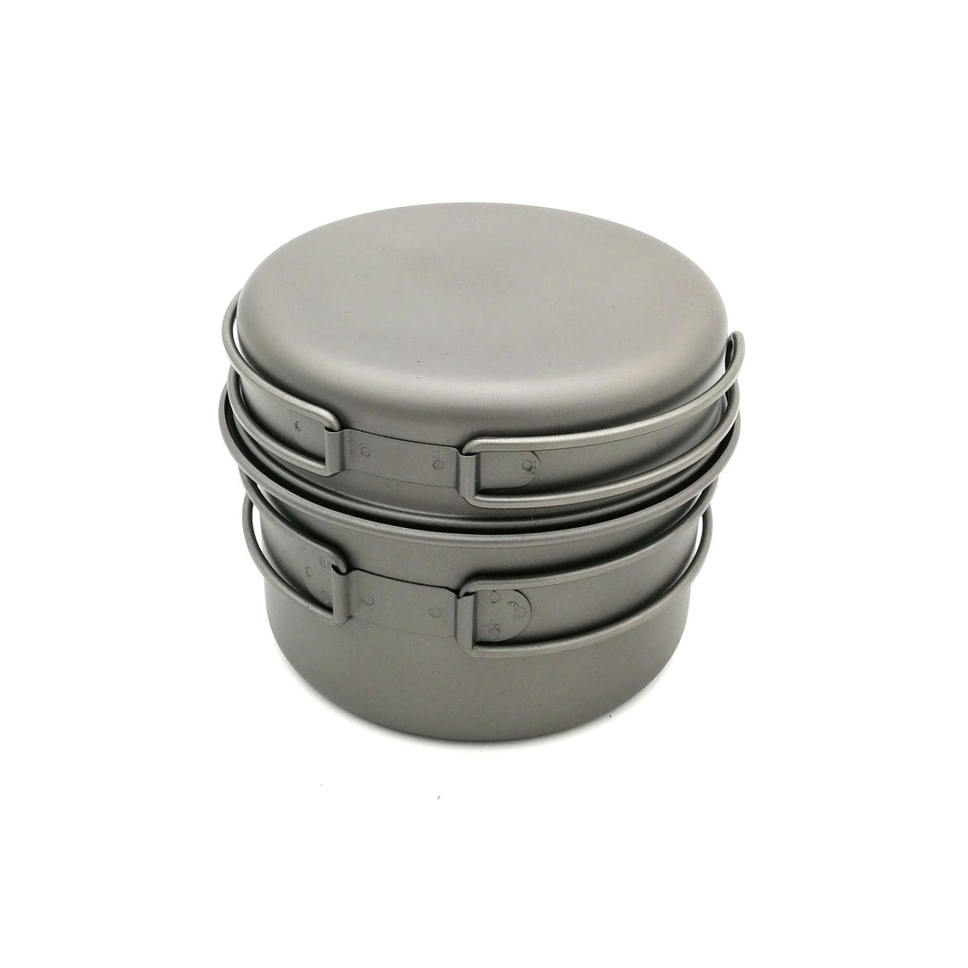 ultra-light titanium backpacking cook set with nesting pots, non-stick finish, foldable handles and compact micro gas burner Stornfield