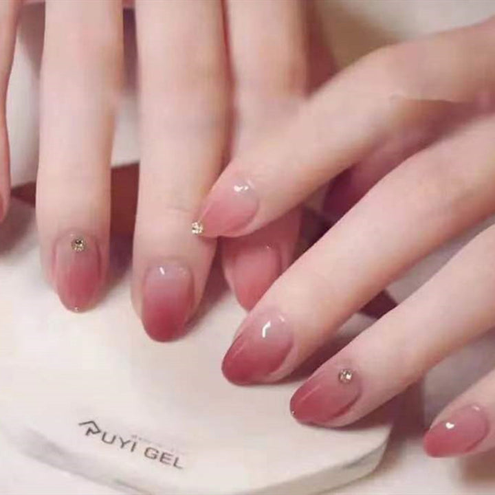 Artificial nails with elegant ombre effect and rhinestone decorations Stornfield