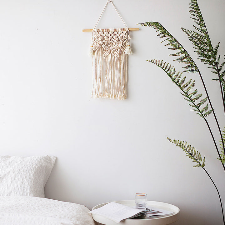 Macramé wall hanging with geometric triple tassel design and wooden rod Stornfield