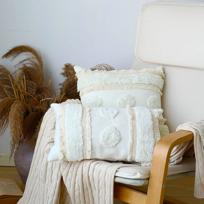 Decorative cushion cover with hand-tufted texture and fringe application