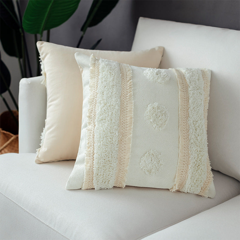 Decorative cushion cover with hand-tufted texture and fringe application