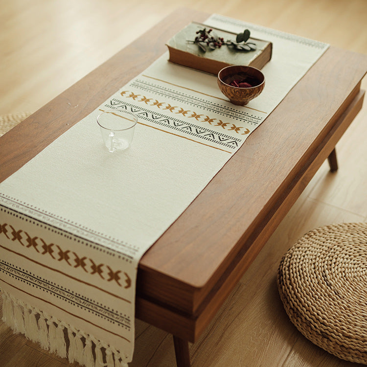 Woven Boho table runner made of cotton blend with decorative fringes and graphic stripe pattern Stornfield