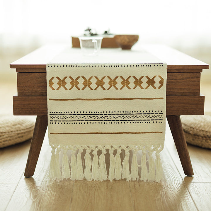 Woven Boho table runner made of cotton blend with decorative fringes and graphic stripe pattern Stornfield