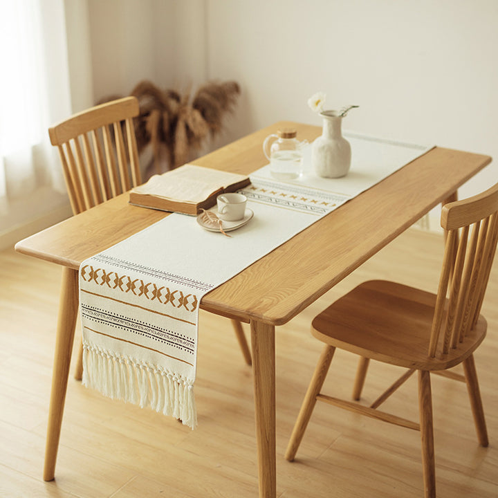 Woven Boho table runner made of cotton blend with decorative fringes and graphic stripe pattern Stornfield