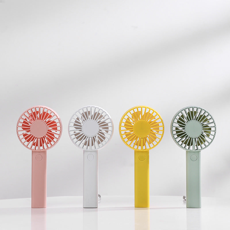 Unisex portable battery-operated mini hand fan with one-button operation and protected fan grill Stornfield