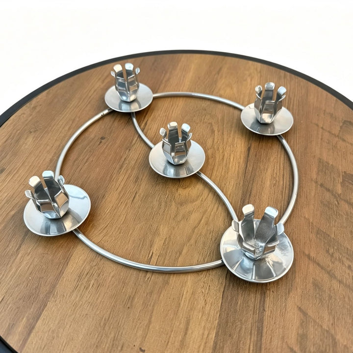 Metal candle holder in wreath design