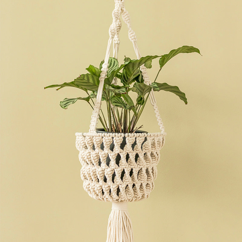 Macrame plant hanger made of cotton rope with tassels and adjustable suspension Stornfield