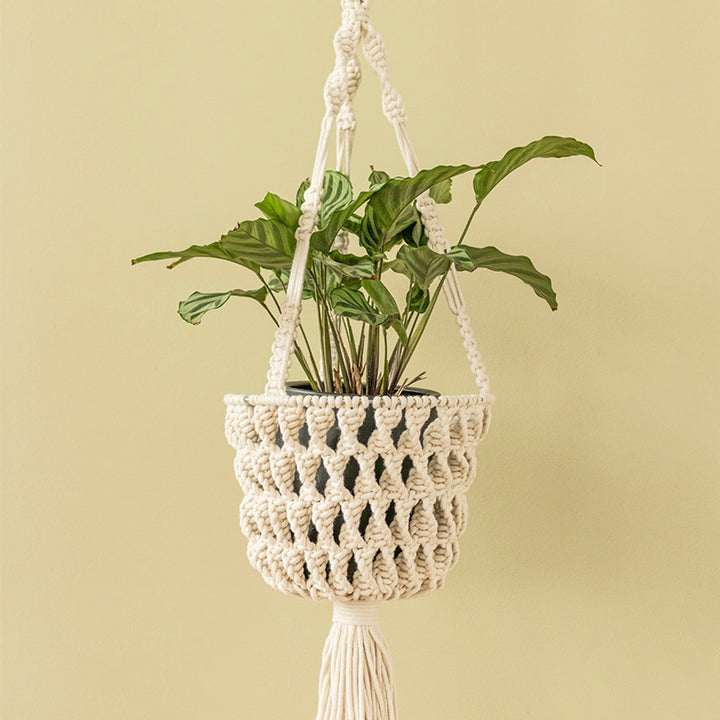 Macrame plant hanger made of cotton rope with tassels and adjustable suspension Stornfield