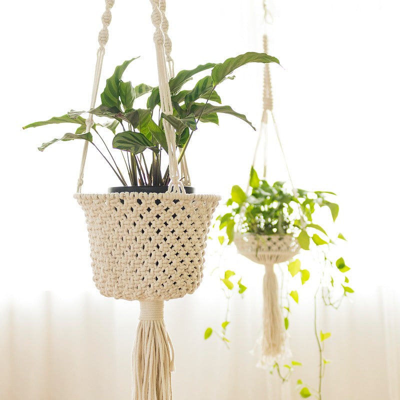Macrame plant hanger made of cotton rope with tassels and adjustable suspension Stornfield
