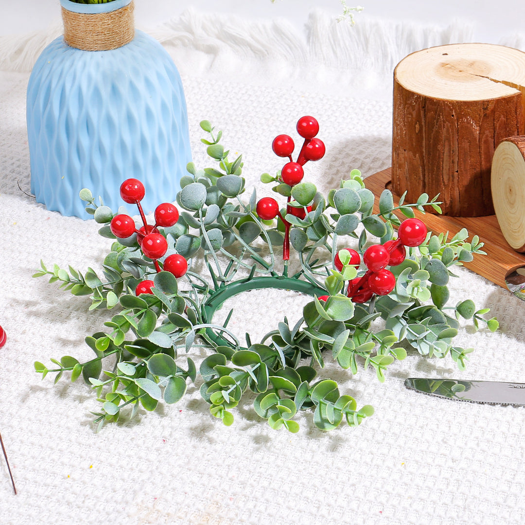 Christmas candle wreath with red berries