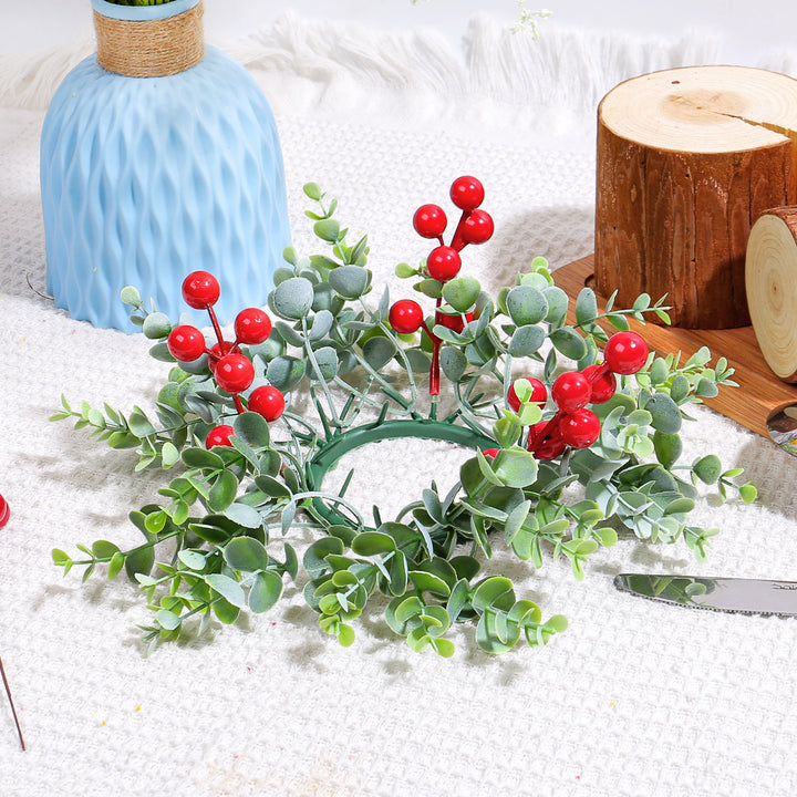 Christmas candle wreath with red berries