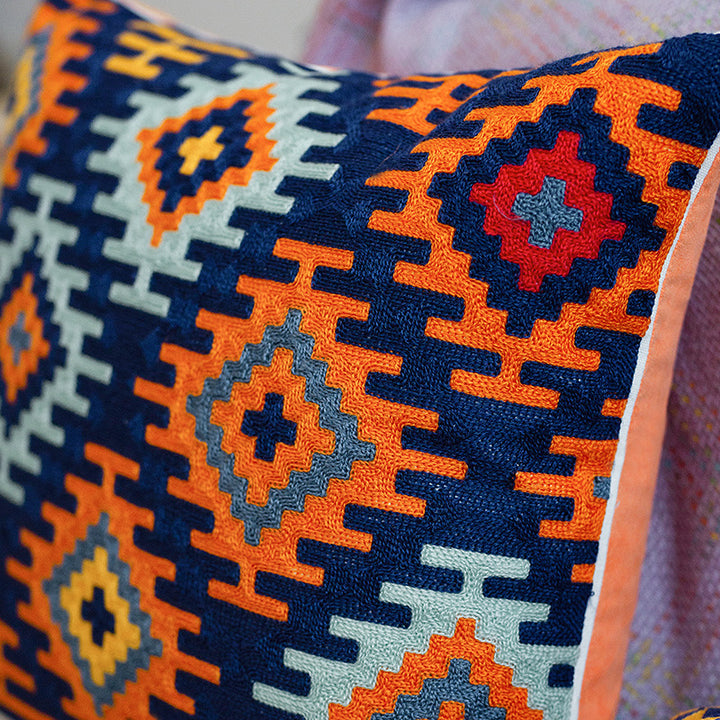Woven decorative cushion cover with hand-tufted ethnic zigzag pattern