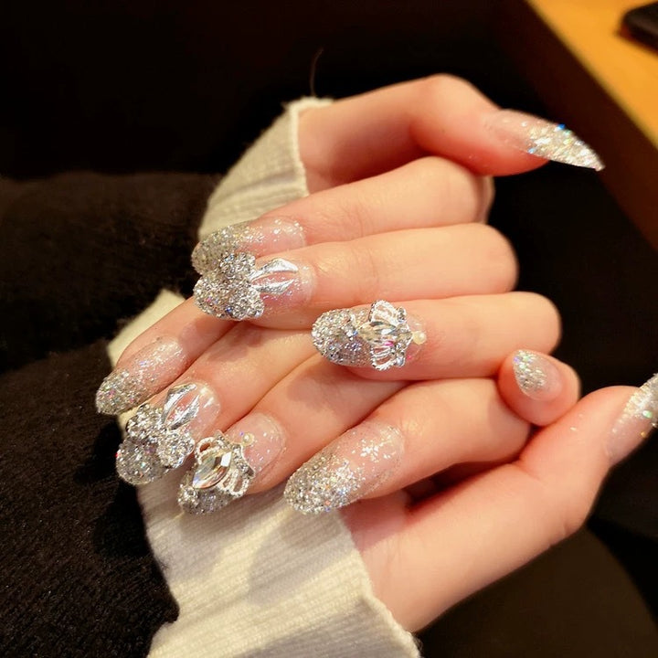 Nail art with sparkling rhinestone and glitter accents Stornfield