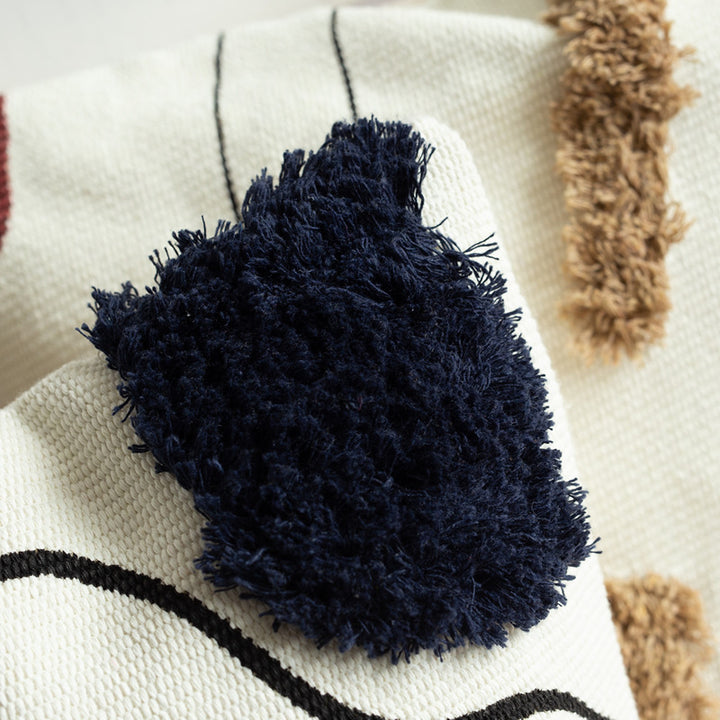 Woven decorative cushion cover in an abstract-minimalist Scandi look with hand-tufted applications