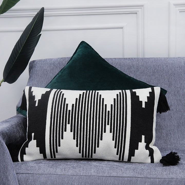 Rectangular woven cushion cover in ethnic jacquard with four tassels and concealed zipper