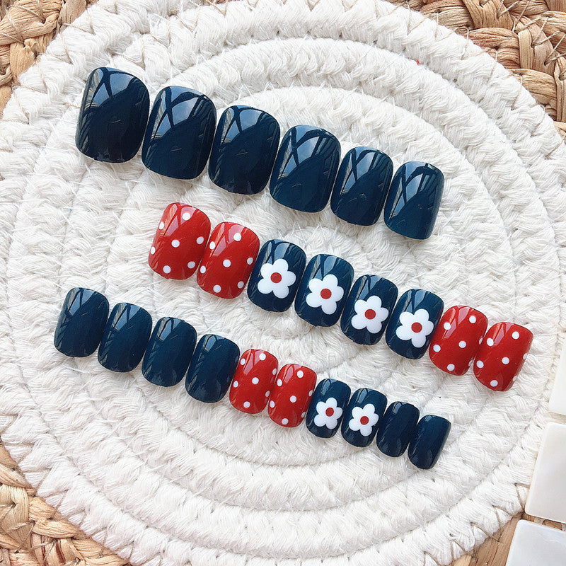 Artificial nails in a creative design with floral accents Stornfield