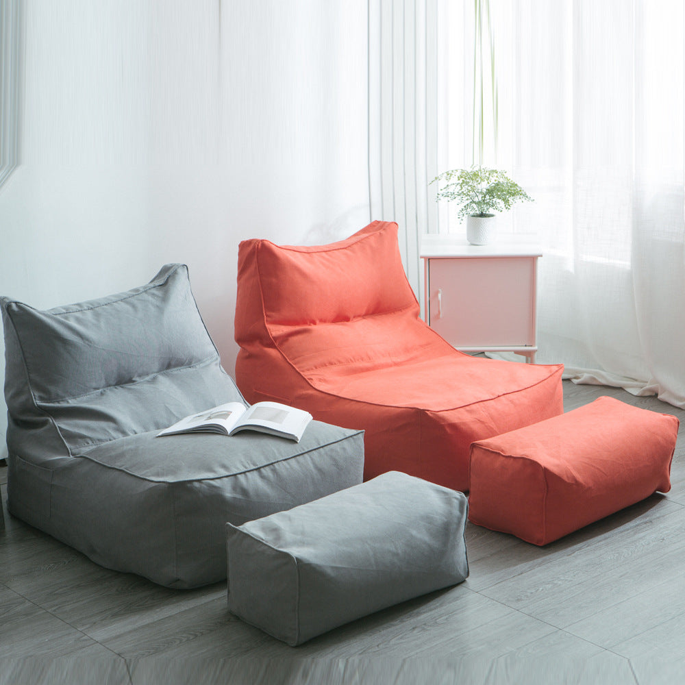 Comfortable lounge bean bag with ergonomic backrest and separate footstool