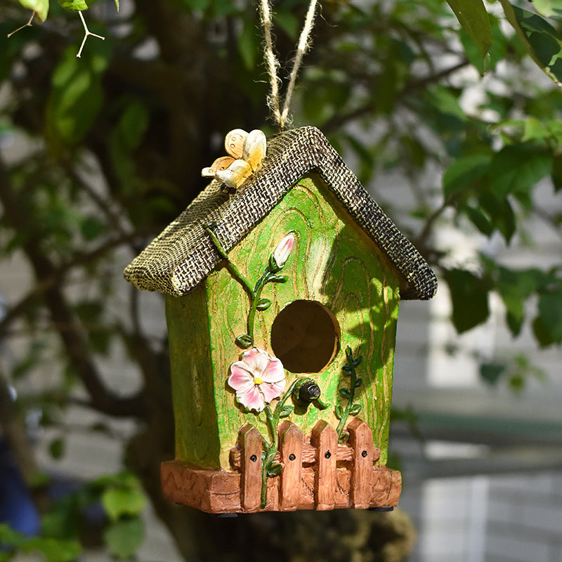 Decorative birdhouse made of resin for the wall
