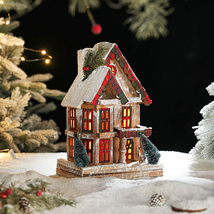 Illuminated wooden Christmas house in European retro style