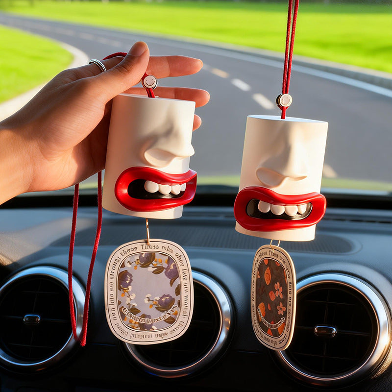 Car fragrance hanger with abstract lip design