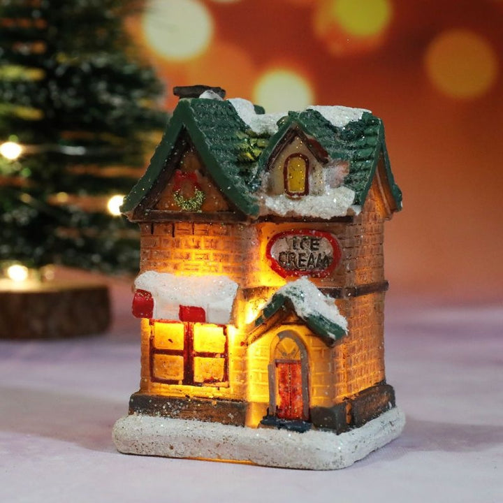 Illuminated Christmas house made of resin